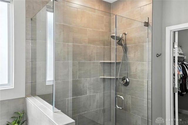 539 Bellasera Dr, Sugarcreek Twp, OH 45440 - bathroom featuring a stall shower and a spacious closet