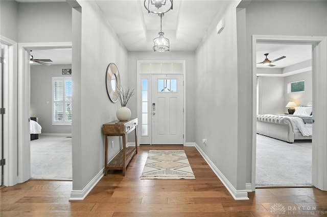 539 Bellasera Dr, Sugarcreek Twp, OH 45440 - entryway with ceiling fan, wood-type flooring, and a tray ceiling