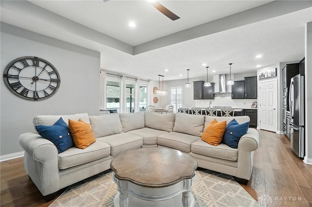 539 Bellasera Dr, Sugarcreek Twp, OH 45440 - living room with light wood-style flooring, a ceiling fan, and recessed lighting