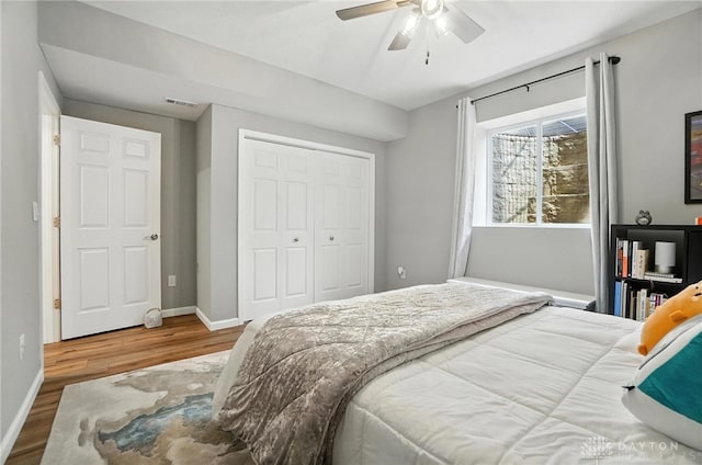 539 Bellasera Dr, Sugarcreek Twp, OH 45440 - bedroom featuring wood finished floors, a closet, and ceiling fan