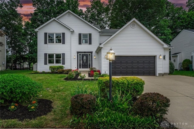 4182 Fox Fern Ct, Beavercreek, OH 45432 - traditional-style house featuring concrete driveway, an attached garage, and a front lawn
