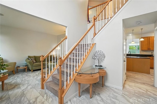 4546 Brackenview Ct, Mason, OH 45040 - stairs with marble finish floors and a high ceiling