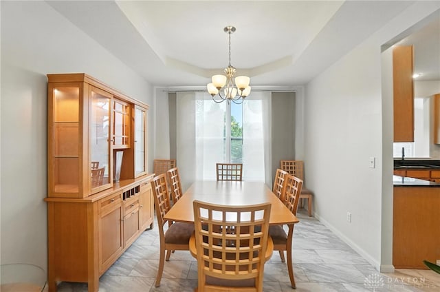4546 Brackenview Ct, Mason, OH 45040 - dining space with a chandelier, light marble finish floors, and a raised ceiling