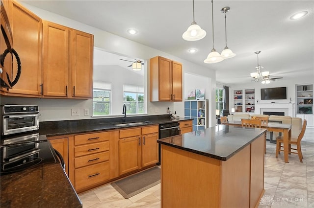 4546 Brackenview Ct, Mason, OH 45040 - kitchen featuring a chandelier, light marble finish floors, black dishwasher, open floor plan, and a center island