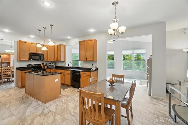 4546 Brackenview Ct, Mason, OH 45040 - kitchen with black appliances, a chandelier, a center island, dark countertops, and recessed lighting