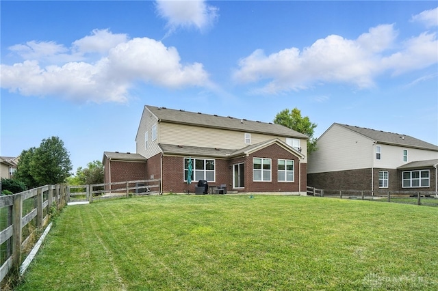 4546 Brackenview Ct, Mason, OH 45040 - rear view of house with brick siding and a fenced backyard