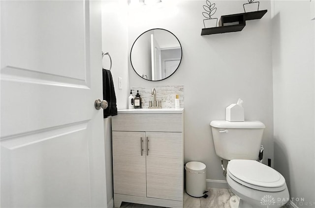 4546 Brackenview Ct, Mason, OH 45040 - bathroom featuring vanity, marble look tiles, and backsplash