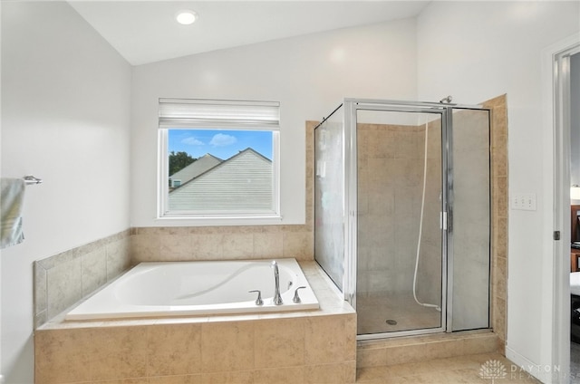 4546 Brackenview Ct, Mason, OH 45040 - bathroom featuring a bath, a stall shower, and vaulted ceiling