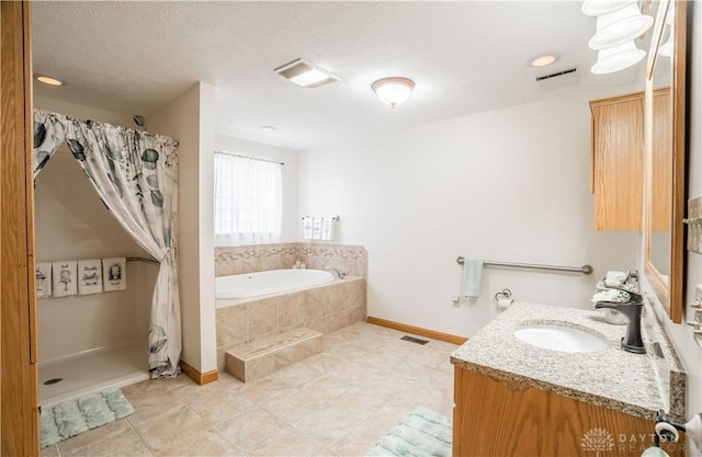 429 Rader Dr, Vandalia, OH 45377 - bathroom with vanity, a bath, tile patterned flooring, a shower with shower curtain, and a textured ceiling