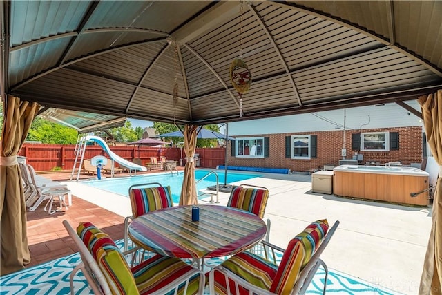 429 Rader Dr, Vandalia, OH 45377 - fenced backyard with a patio, a gazebo, outdoor dining space, and a playground