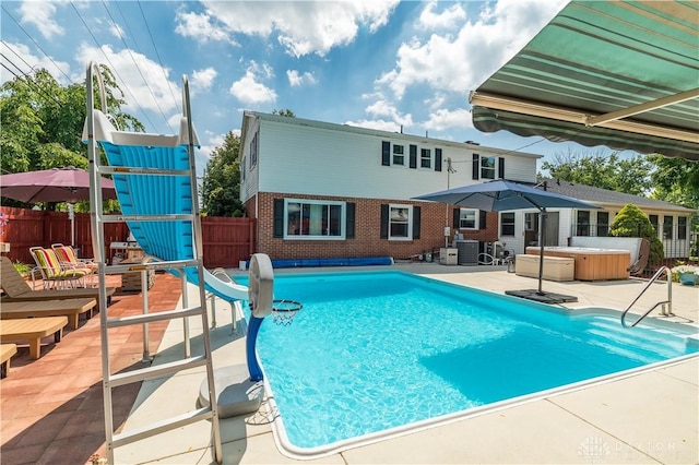 429 Rader Dr, Vandalia, OH 45377 - view of pool with a hot tub, a patio, a water slide, and a fenced backyard