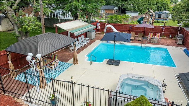 429 Rader Dr, Vandalia, OH 45377 - community pool with a fenced backyard, a water slide, a patio, a deck, and a grill