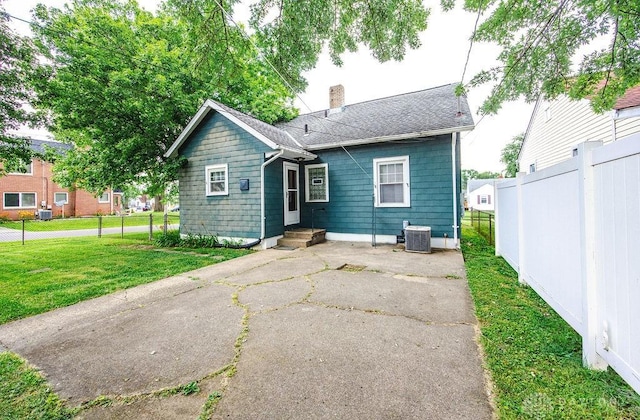 677 Ridgewood Ave, Hamilton, OH 45013 - back of house with a chimney and a patio
