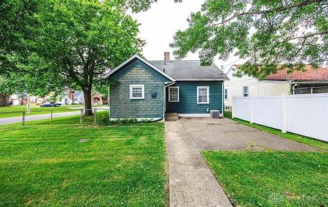 677 Ridgewood Ave, Hamilton, OH 45013 - rear view of property featuring a chimney