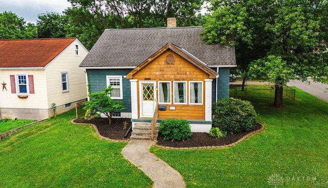 677 Ridgewood Ave, Hamilton, OH 45013 - bungalow-style home featuring a chimney and roof with shingles