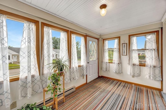 677 Ridgewood Ave, Hamilton, OH 45013 - unfurnished sunroom with healthy amount of natural light, a baseboard radiator, carpet floors, and ornamental molding