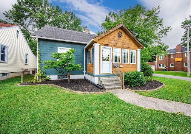 677 Ridgewood Ave, Hamilton, OH 45013 - view of front facade with a front yard, entry steps, and a chimney