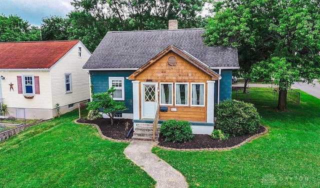 677 Ridgewood Ave, Hamilton, OH 45013 - bungalow featuring a chimney and a shingled roof