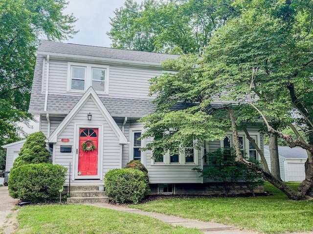 1110 E Main St, Troy, OH 45373 - view of front of house featuring a front yard and roof with shingles
