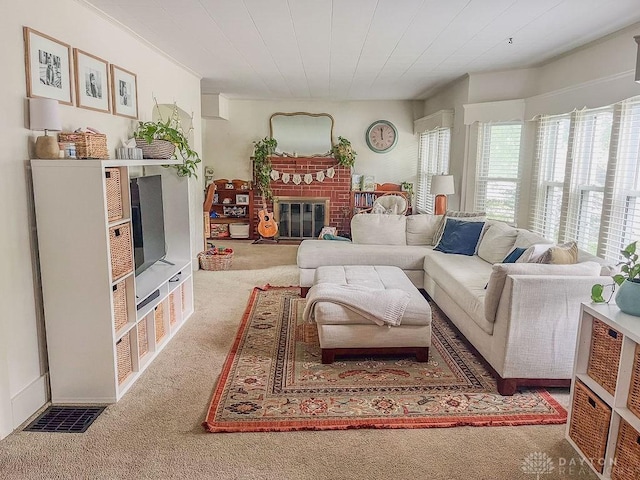 1110 E Main St, Troy, OH 45373 - living area featuring healthy amount of natural light, carpet floors, and a fireplace