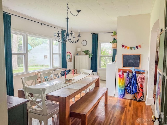 1110 E Main St, Troy, OH 45373 - dining area featuring a chandelier and wood finished floors