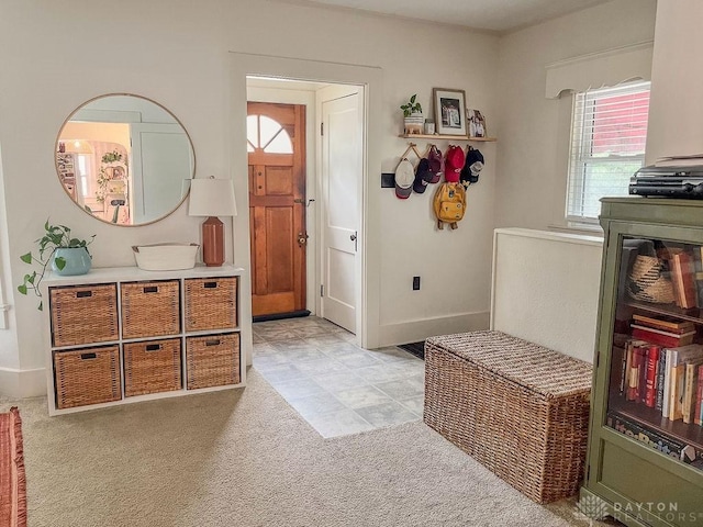 1110 E Main St, Troy, OH 45373 - foyer entrance featuring healthy amount of natural light and light colored carpet