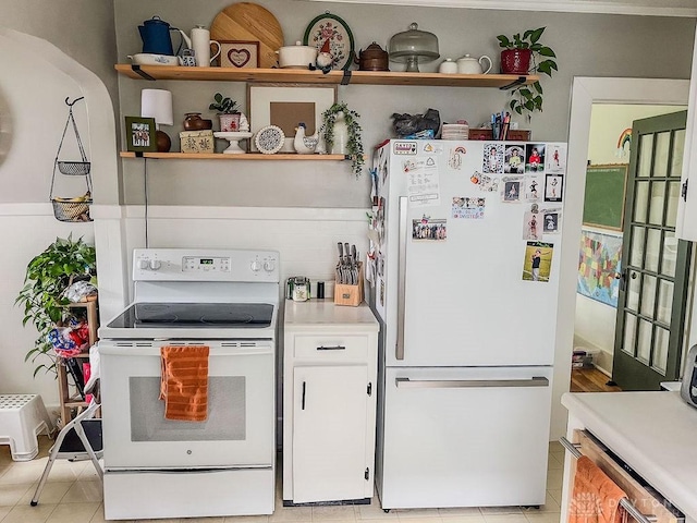 1110 E Main St, Troy, OH 45373 - kitchen with white appliances, open shelves, light countertops, white cabinetry, and light tile patterned floors