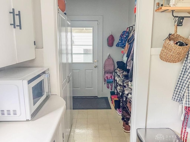 1110 E Main St, Troy, OH 45373 - laundry room featuring cabinet space