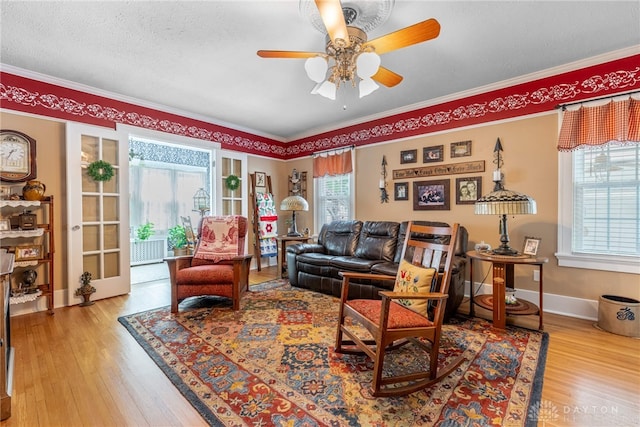 288 N King St, Xenia, OH 45385 - living room with crown molding, wood finished floors, ceiling fan, and a textured ceiling