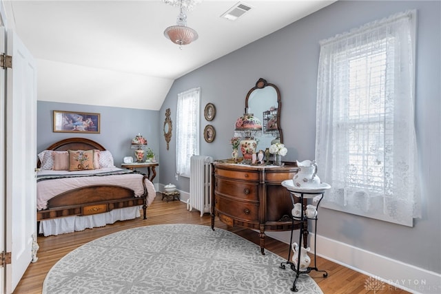 288 N King St, Xenia, OH 45385 - bedroom featuring radiator, vaulted ceiling, and wood finished floors
