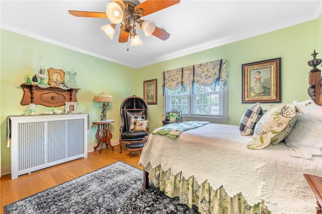 288 N King St, Xenia, OH 45385 - bedroom with wood finished floors, crown molding, and ceiling fan