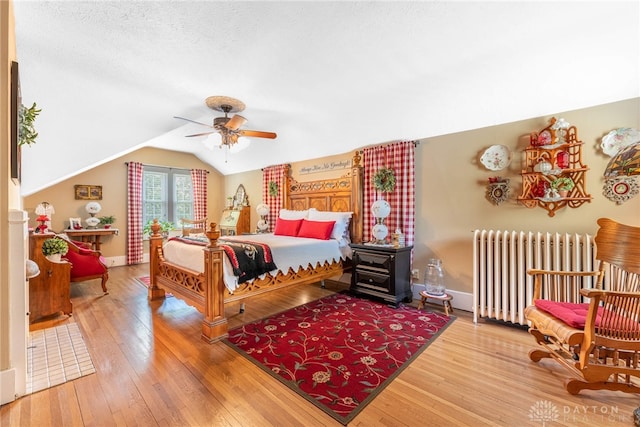 288 N King St, Xenia, OH 45385 - bedroom featuring radiator heating unit, lofted ceiling, wood-type flooring, and ceiling fan
