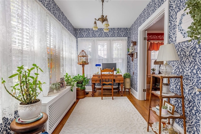 288 N King St, Xenia, OH 45385 - office with wallpapered walls, radiator, a chandelier, and wood finished floors