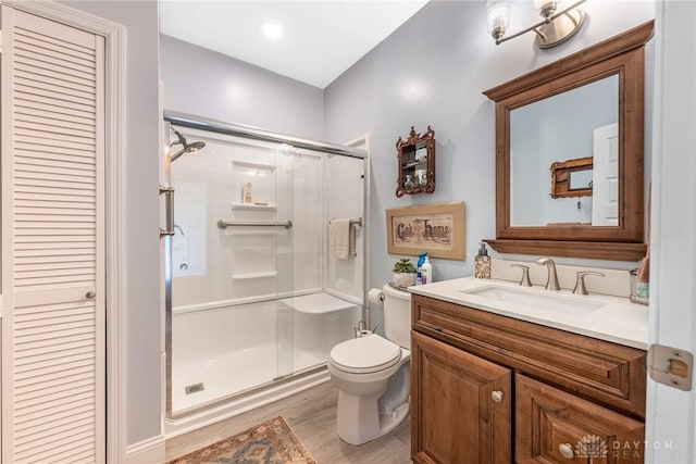 288 N King St, Xenia, OH 45385 - full bathroom featuring a shower stall, vanity, wood finished floors, and a closet
