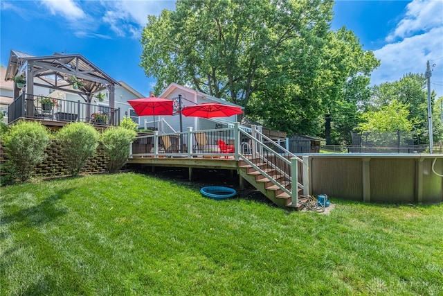 288 N King St, Xenia, OH 45385 - view of yard featuring a wooden deck, stairs, and an outdoor pool