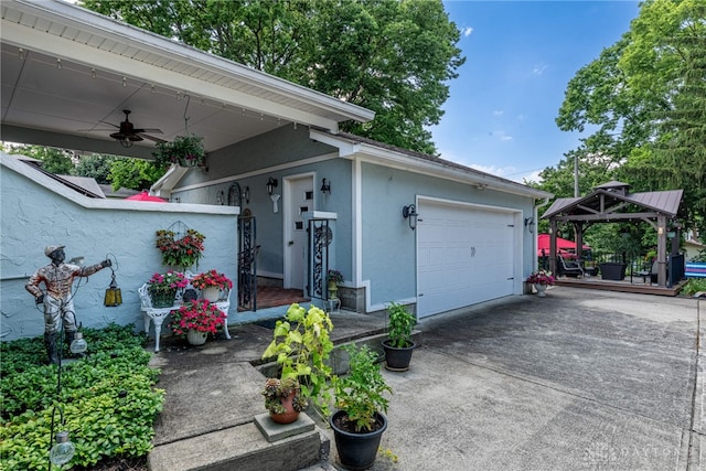 288 N King St, Xenia, OH 45385 - view of front of property featuring stucco siding, a gazebo, ceiling fan, driveway, and an attached garage