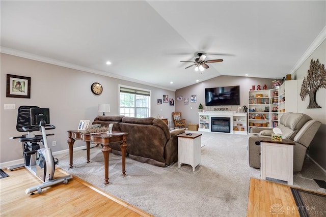 4095 N State Route 42, Waynesville, OH 45068 - living area with ceiling fan, ornamental molding, a glass covered fireplace, recessed lighting, and lofted ceiling