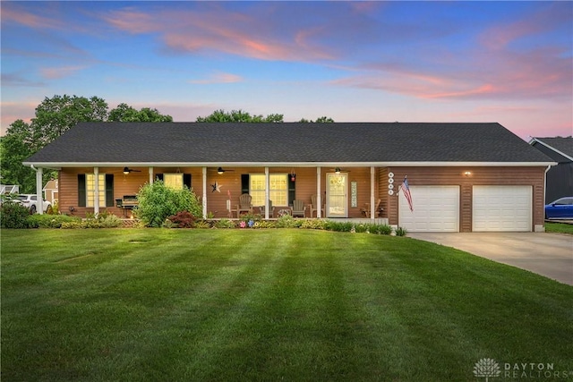 4095 N State Route 42, Waynesville, OH 45068 - view of front of property featuring a porch, an attached garage, a front lawn, driveway, and ceiling fan