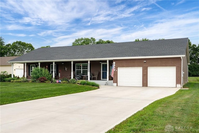 4095 N State Route 42, Waynesville, OH 45068 - ranch-style house featuring a porch, a garage, a front yard, and driveway