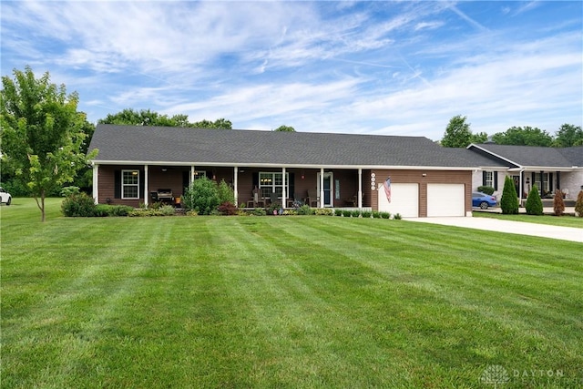 4095 N State Route 42, Waynesville, OH 45068 - single story home featuring covered porch, an attached garage, a front yard, and concrete driveway