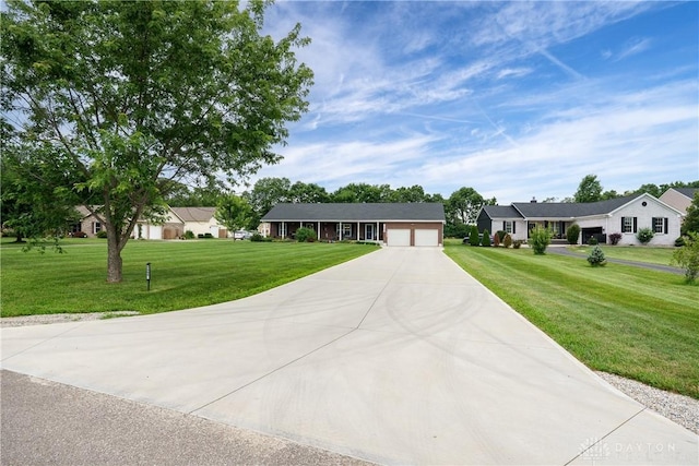4095 N State Route 42, Waynesville, OH 45068 - ranch-style house with a garage, driveway, and a front lawn
