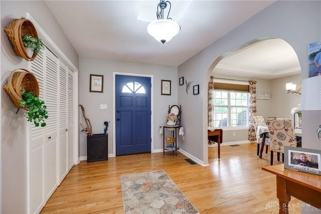 4095 N State Route 42, Waynesville, OH 45068 - foyer entrance featuring arched walkways and light wood finished floors