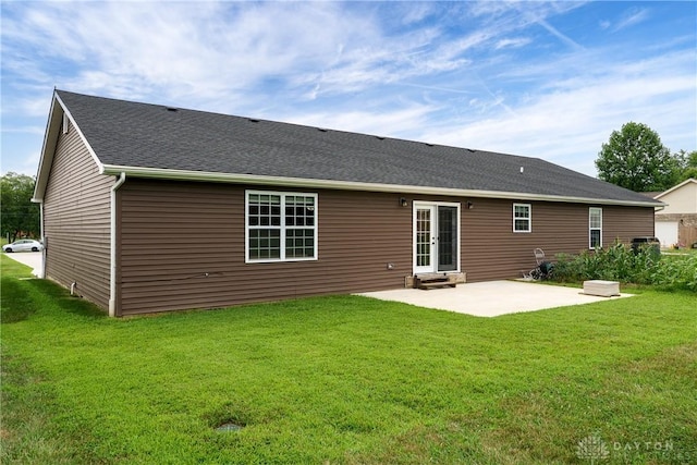 4095 N State Route 42, Waynesville, OH 45068 - rear view of property with a patio, a lawn, entry steps, and roof with shingles