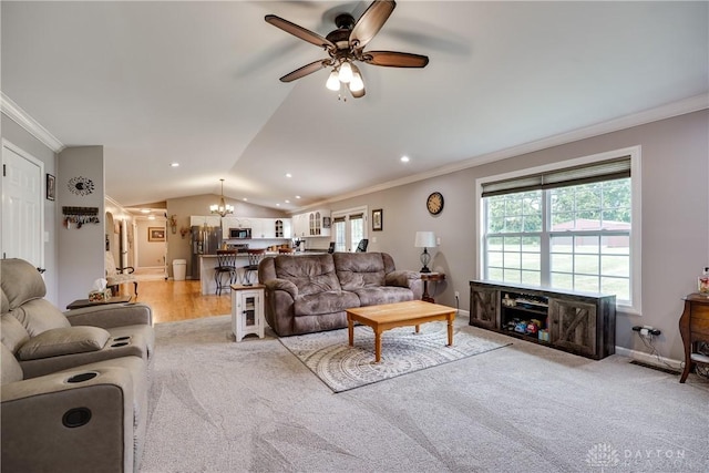 4095 N State Route 42, Waynesville, OH 45068 - living area with ornamental molding, a chandelier, a ceiling fan, light colored carpet, and vaulted ceiling