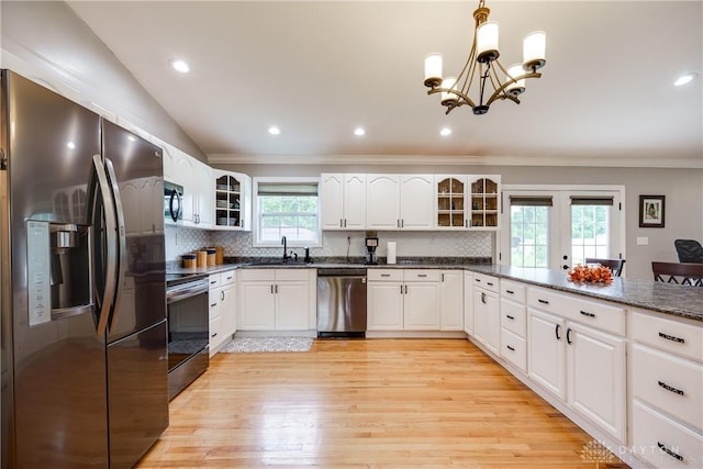 4095 N State Route 42, Waynesville, OH 45068 - kitchen featuring stainless steel appliances, ornamental molding, glass insert cabinets, a chandelier, and backsplash