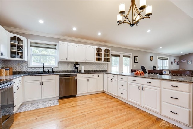 4095 N State Route 42, Waynesville, OH 45068 - kitchen with appliances with stainless steel finishes, ornamental molding, healthy amount of natural light, light wood-type flooring, and tasteful backsplash