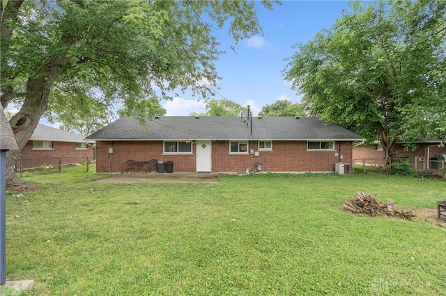 2227 Los Arrow Dr, Dayton, OH 45439 - back of house featuring a patio area, brick siding, a fenced backyard, and an outdoor fire pit
