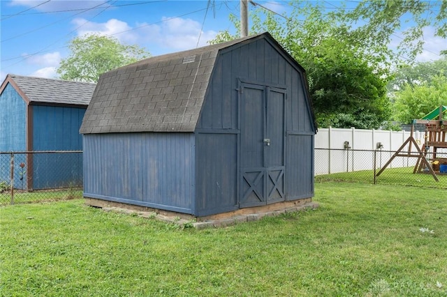 2227 Los Arrow Dr, Dayton, OH 45439 - view of shed with a playground and a fenced backyard