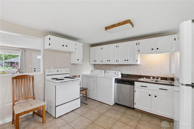 2227 Los Arrow Dr, Dayton, OH 45439 - kitchen with white appliances, washing machine and clothes dryer, white cabinets, tasteful backsplash, and light tile patterned flooring
