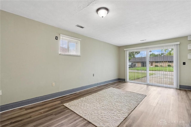 2227 Los Arrow Dr, Dayton, OH 45439 - unfurnished room with wood finished floors and a textured ceiling